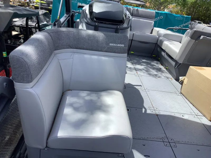 Slide: The Image of 2024 Sea-Doo Switch Cruise 18 interior with gray seating and spacious deck layout. - 9