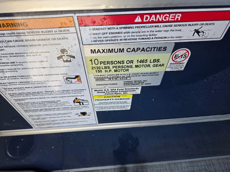 Slide: The Image of Warning and capacity labels on a 2021 Berkshire 22 RFX LE-Series boat. - 10