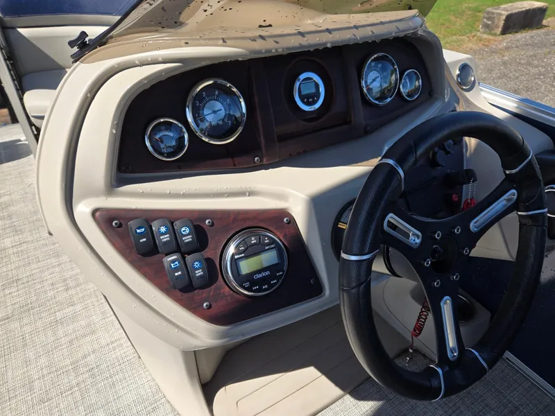 Slide: The Image of Dashboard of 2021 Berkshire 22 RFX LE-Series boat with steering wheel and gauges. - 11