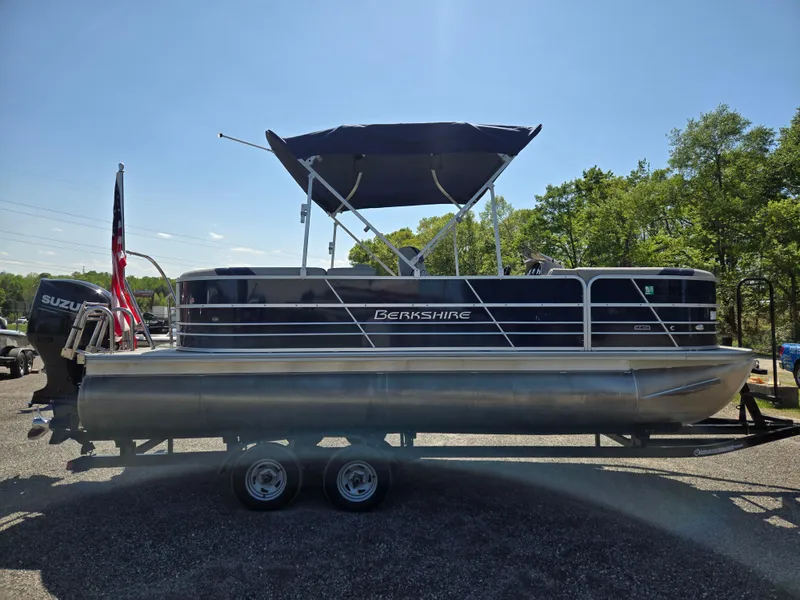 Slide: The Image of 2021 Berkshire 22 RFX LE-Series pontoon boat with canopy on trailer, side view. - 4