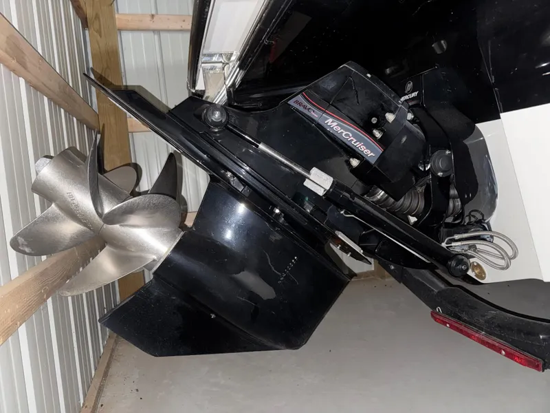 Slide: The Image of 2019 Sea Ray SPX 230 boat with MerCruiser engine and propeller in storage. - 23