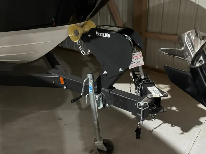 Slide: The Image of Trailer hitch of a 2019 Sea Ray SPX 230 boat in a storage area. - 25