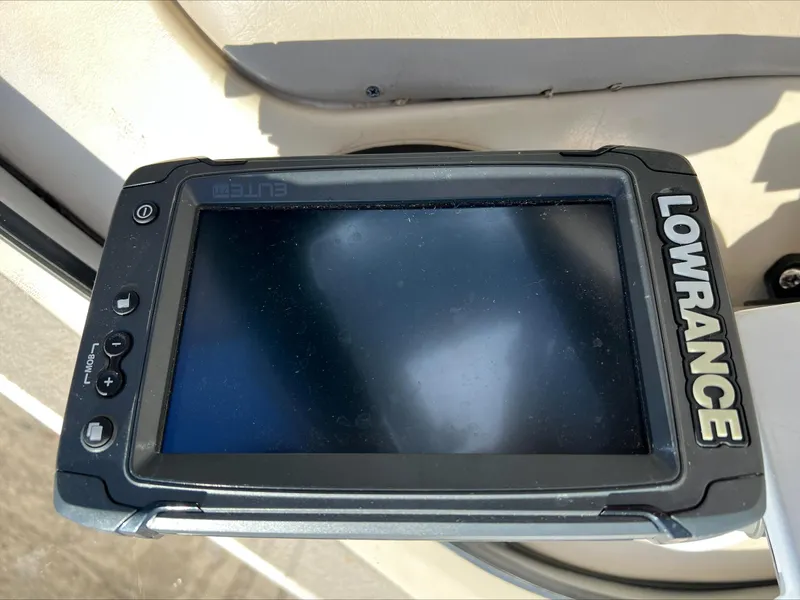 Slide: The Image of Lowrance fish finder on 2001 Alumacraft Trophy 185 boat dashboard. - 13
