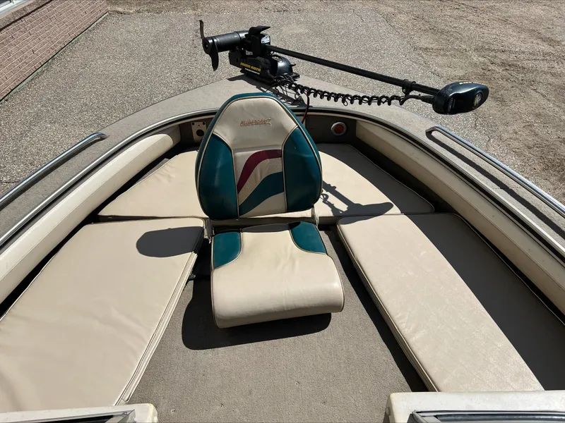 Slide: The Image of 2001 Alumacraft Trophy 185 boat interior with seating and trolling motor. - 3