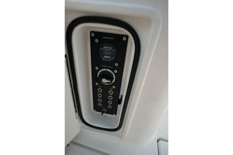 Slide: The Image of Control panel of 2024 Bayliner Trophy T25 Pilothouse boat, featuring digital voltage relay. - 12