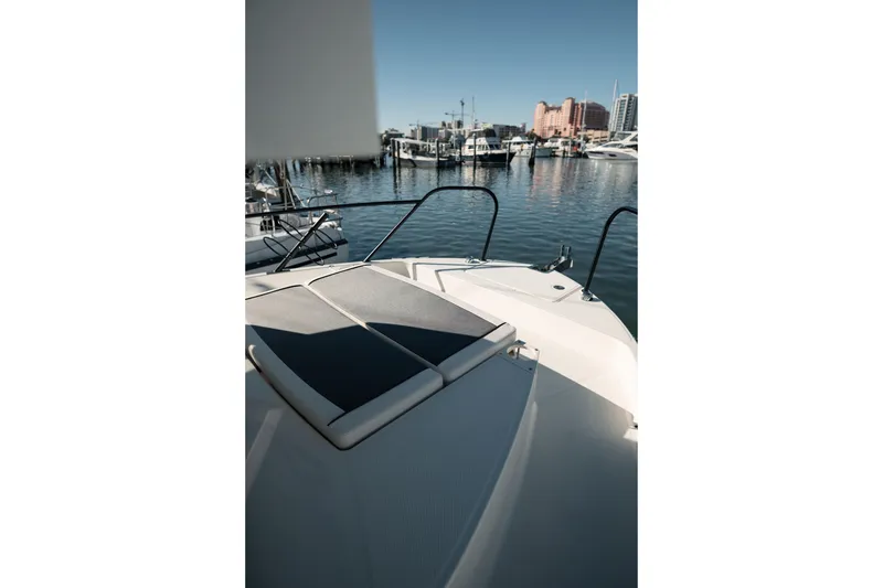 Slide: The Image of 2024 Bayliner Trophy T25 Pilothouse boat docked in a marina. - 19