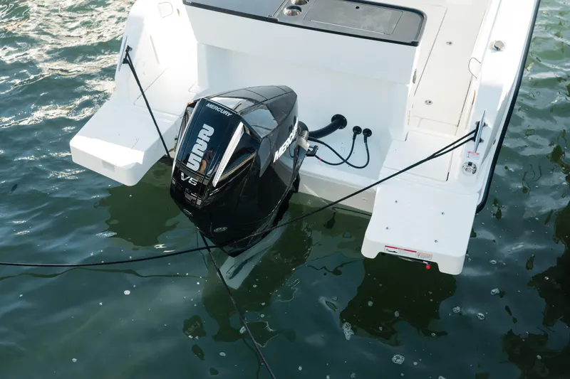 Slide: The Image of 2024 Bayliner Trophy T25 Pilothouse with Mercury V6 outboard engine on water. - 22