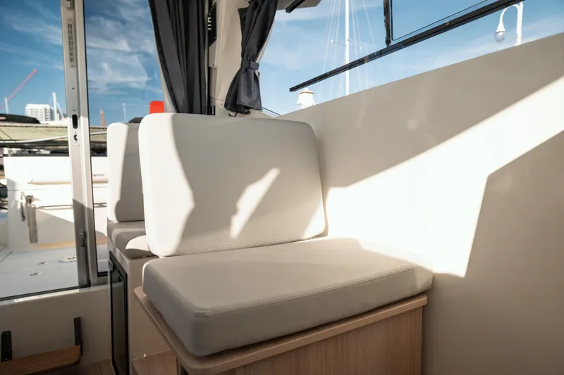 Slide: The Image of Interior seating of 2024 Bayliner Trophy T25 Pilothouse, featuring modern design and natural light. - 3