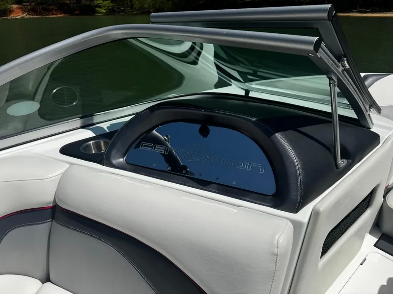 Slide: The Image of 2012 Centurion Enzo SV230 boat interior with sleek white and black seating. - 13