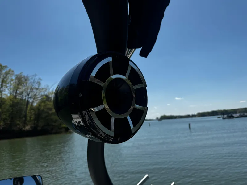 Slide: The Image of Speaker on a 2012 Centurion Enzo SV230 boat, with a scenic lake view. - 19