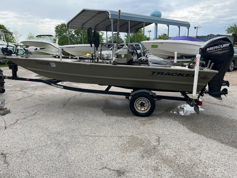 Slide: The Image of 2017 Tracker Grizzly 1648 boat on trailer with Mercury outboard motor. - 5
