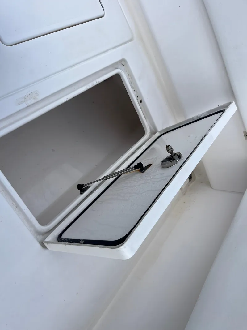 Slide: The Image of 2016 Contender 35 ST boat storage compartment with open hatch. - 10