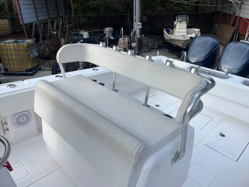 Slide: The Image of 2016 Contender 35 ST boat interior with white seating and rod holders. - 11
