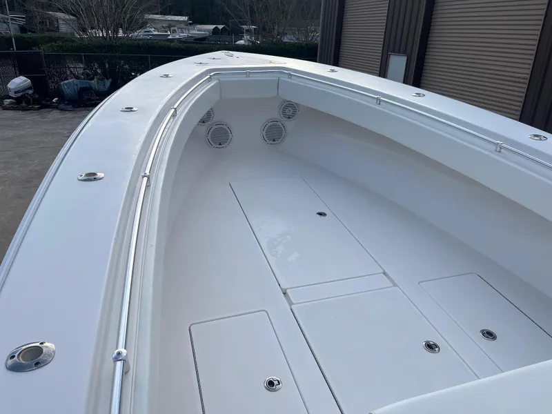 Slide: The Image of 2016 Contender 35 ST boat deck, featuring spacious storage compartments and sleek design. - 12