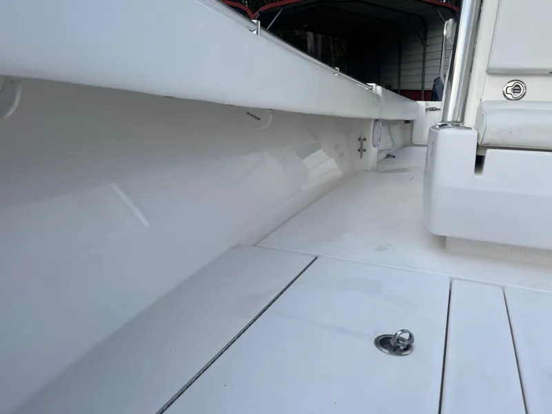 Slide: The Image of 2016 Contender 35 ST boat interior, showcasing sleek white deck and seating area. - 16