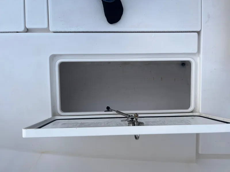 Slide: The Image of Open storage compartment on a 2016 Contender 35 ST boat deck. - 18