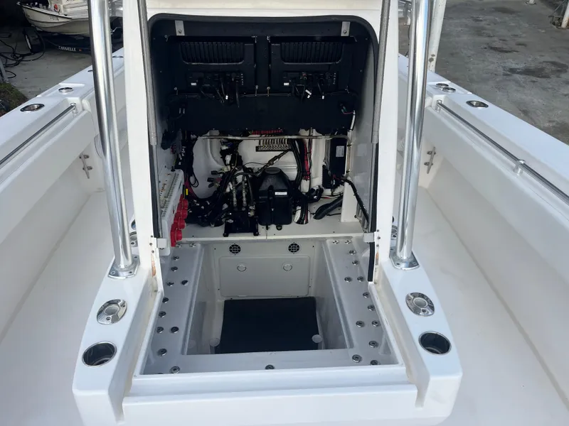 Slide: The Image of 2016 Contender 35 ST boat interior showing open hatch with wiring and components. - 20