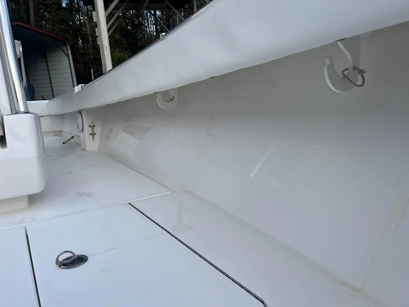 Slide: The Image of 2016 Contender 35 ST boat interior with clean white deck and storage compartments. - 21