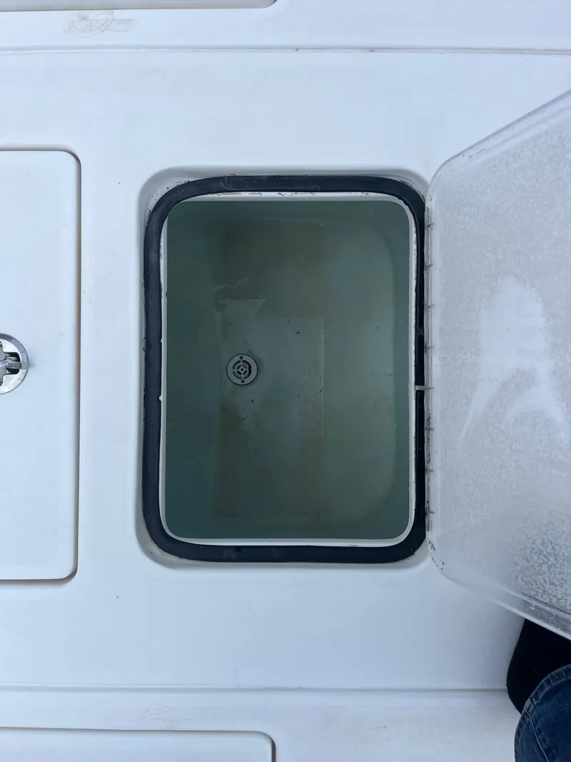 Slide: The Image of Open storage compartment on 2016 Contender 35 ST boat deck. - 24