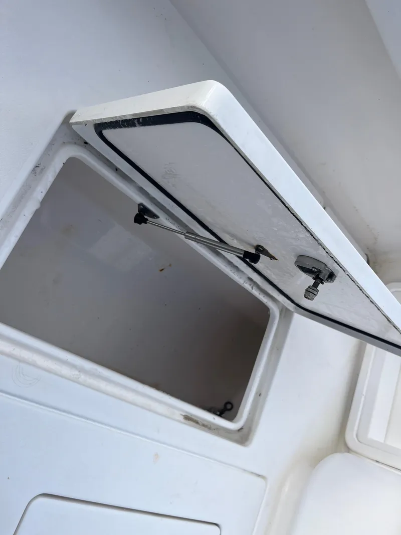 Slide: The Image of Open storage compartment on a 2016 Contender 35 ST boat. - 5
