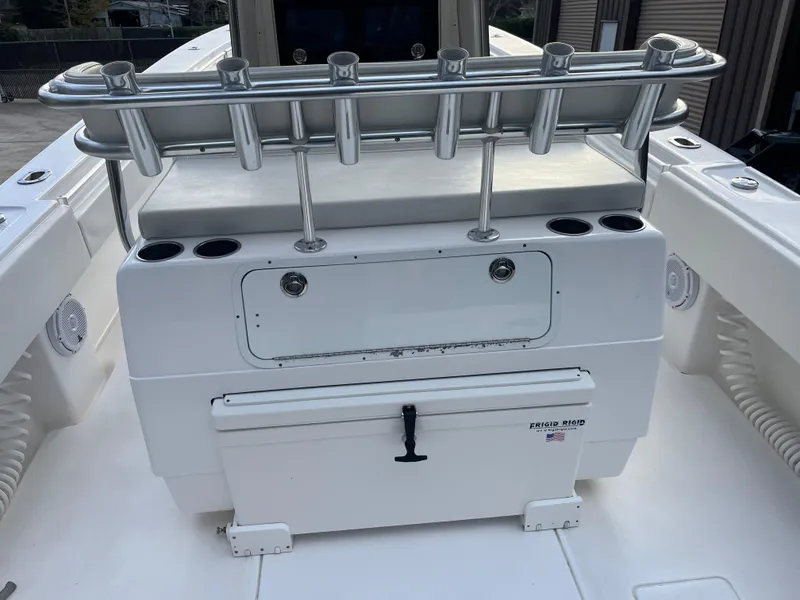 Slide: The Image of 2016 Contender 35 ST boat with rod holders and storage compartments. - 7