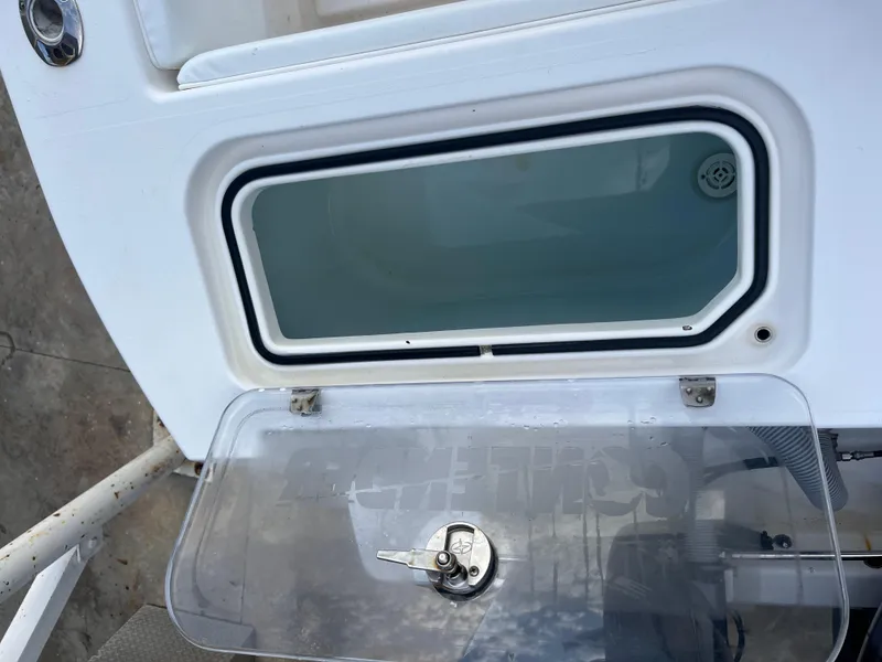 Slide: The Image of 2016 Contender 35 ST boat compartment with transparent lid and secure lock. - 8