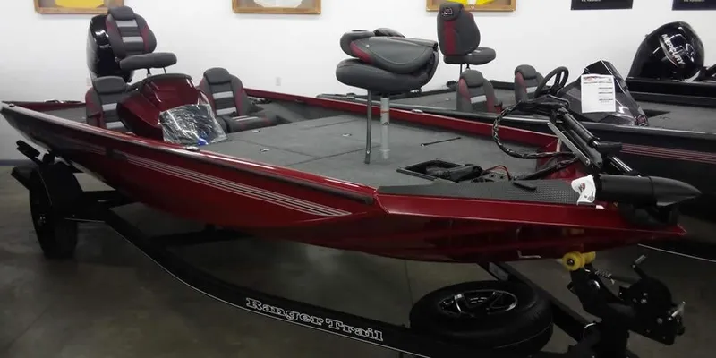 The Image of 2025 Ranger RT188C fishing boat in showroom, featuring sleek red design and modern seating. - 0