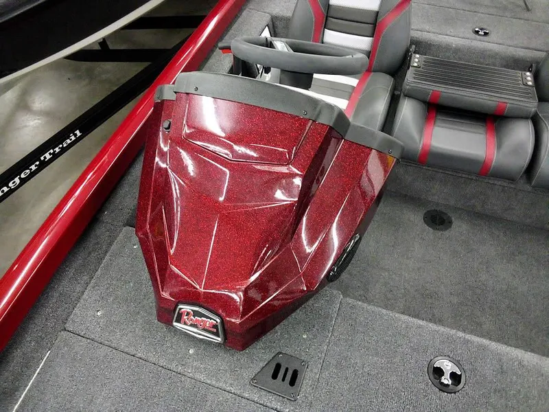 Slide: The Image of 2025 Ranger RT188C boat interior with red metallic finish and seating. - 14
