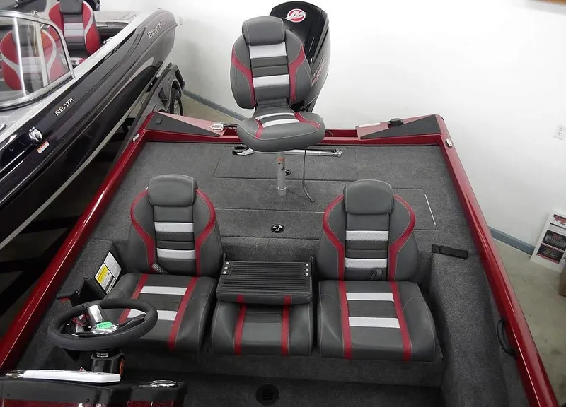 Slide: The Image of 2025 Ranger RT188C boat interior with gray and red seating. - 15