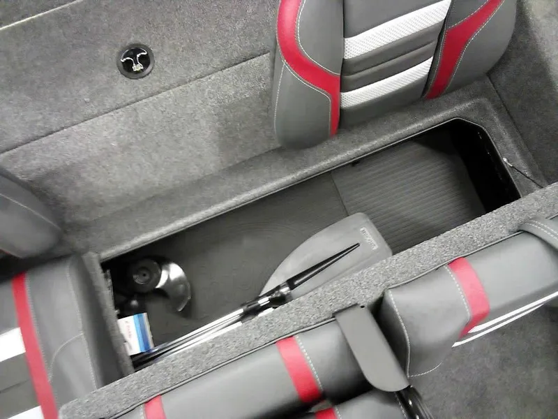 Slide: The Image of Interior of 2025 Ranger RT188C boat with storage compartment and red-accented seats. - 16