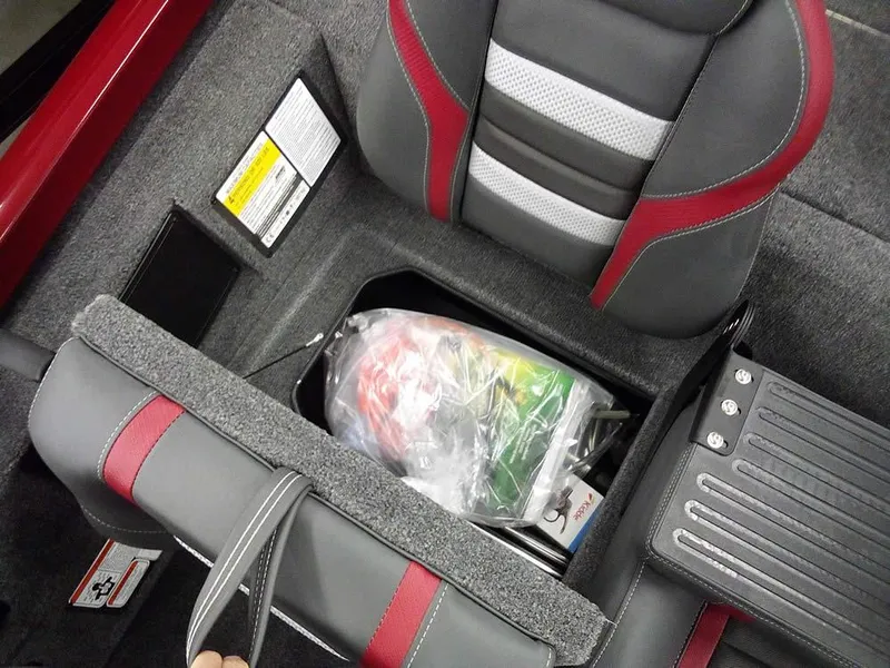 Slide: The Image of 2025 Ranger RT188C boat interior with storage compartment and seat details. - 17