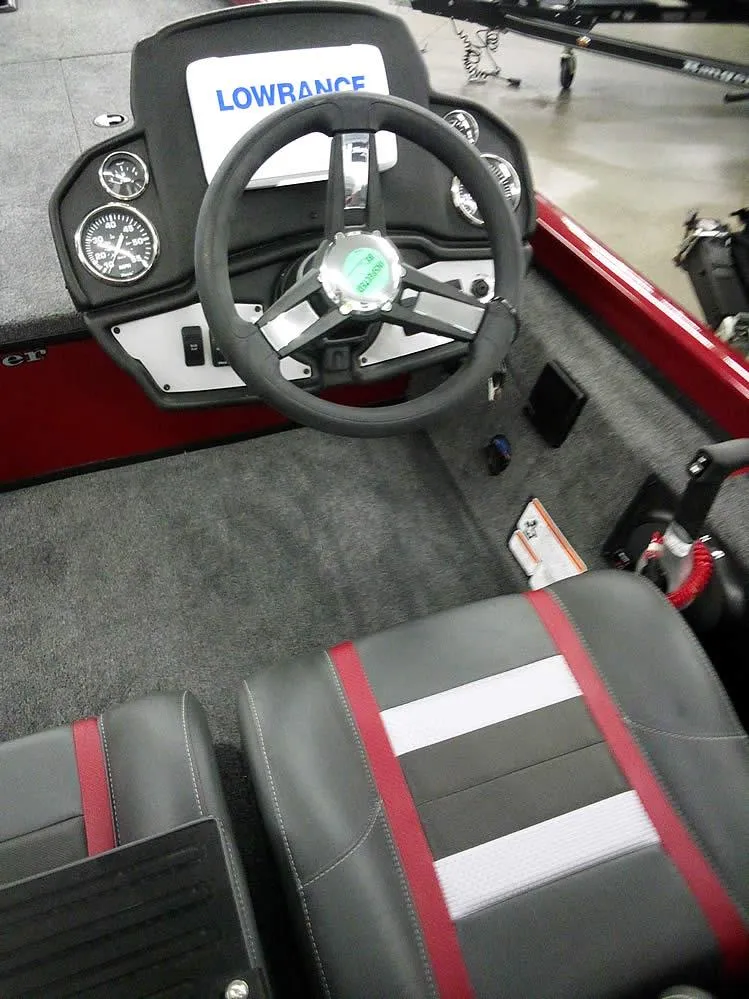 Slide: The Image of 2025 Ranger RT188C boat cockpit with Lowrance electronics and stylish seating. - 19