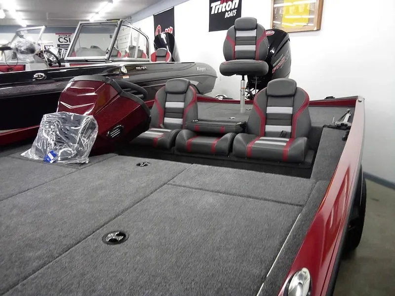 Slide: The Image of 2025 Ranger RT188C boat interior with gray and red seating, showcasing spacious design. - 6
