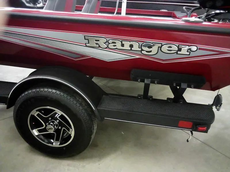 Slide: The Image of 2025 Ranger RT188C boat trailer with red and silver design. - 7