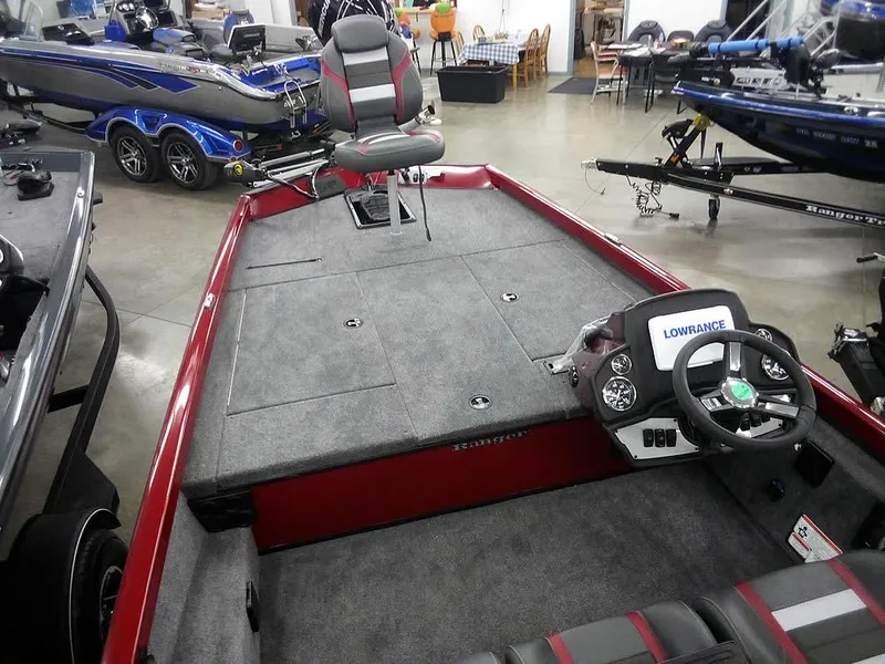 Slide: The Image of 2025 Ranger RT188C fishing boat interior with steering console and seating. - 9