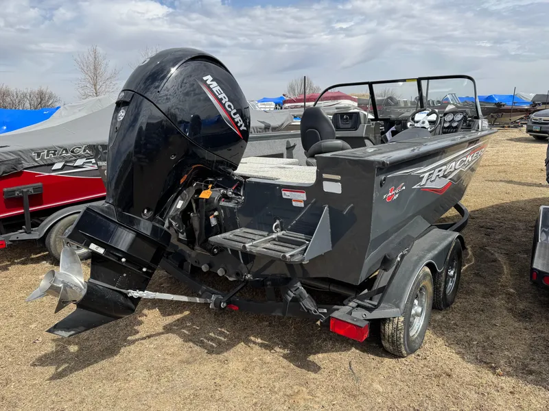 Slide: The Image of 2021 Tracker Targa V-18 Combo boat with Mercury outboard motor on trailer. - 2