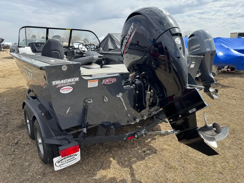 Slide: The Image of 2021 Tracker Targa V-18 Combo boat with Mercury outboard motor on a trailer. - 3