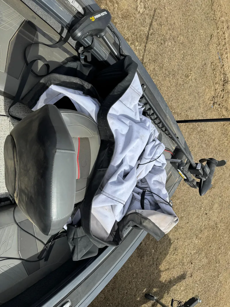 Slide: The Image of 2021 Tracker Targa V-18 Combo boat interior with seat and fishing gear. - 4