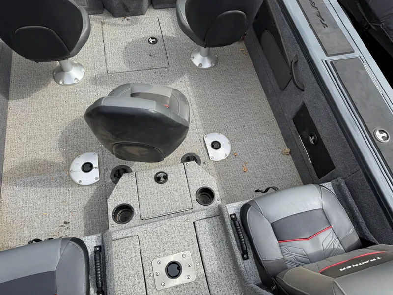 Slide: The Image of 2021 Tracker Targa V-18 Combo boat interior with seating and storage compartments. - 6