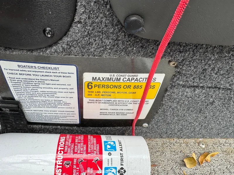 Slide: The Image of 2021 Tracker Targa V-18 Combo capacity label, showing 6-person limit and safety instructions. - 9