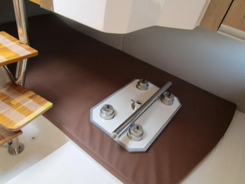 Slide: The Image of Interior of 2025 NX Boats 290, featuring wooden steps and metal fittings. - 14