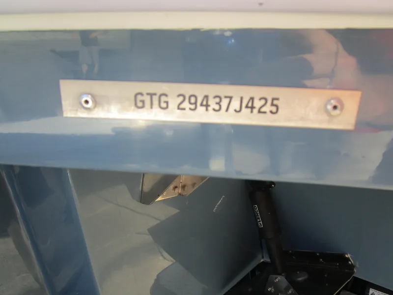 Slide: The Image of 2025 NX Boats 290 hull identification number plate, GTG 29437J425, on blue surface. - 19