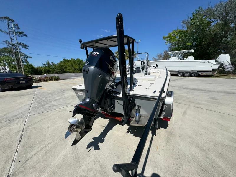 Slide: The Image of 2024 Hewes Redfisher 16 boat with outboard motor on a trailer. - 12