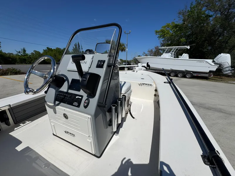 Slide: The Image of 2024 Hewes Redfisher 16 boat interior with steering console and controls. - 24