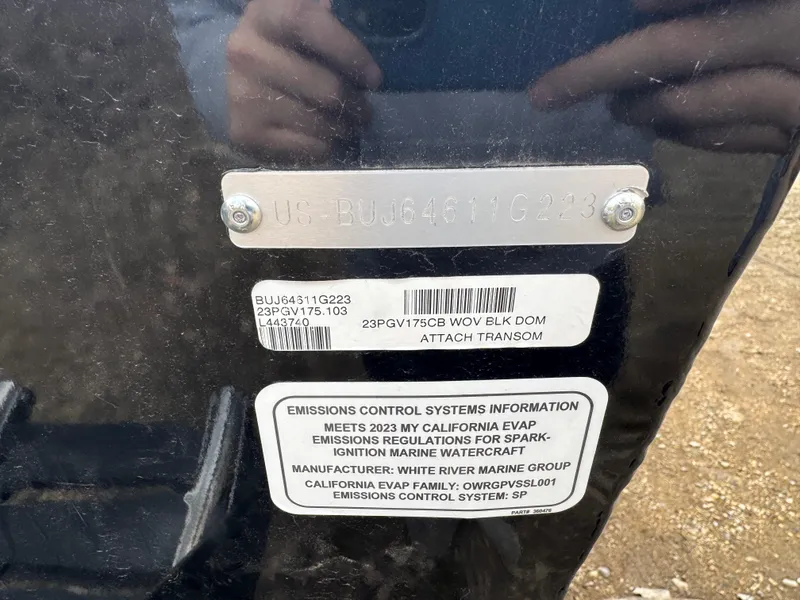 Slide: The Image of 2023 Tracker Pro Guide V-175 WT transom with emissions control information and serial numbers. - 13