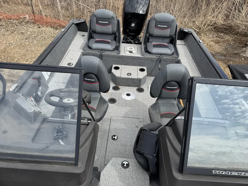 Slide: The Image of 2023 Tracker Pro Guide V-175 WT boat interior with seating and steering console. - 4