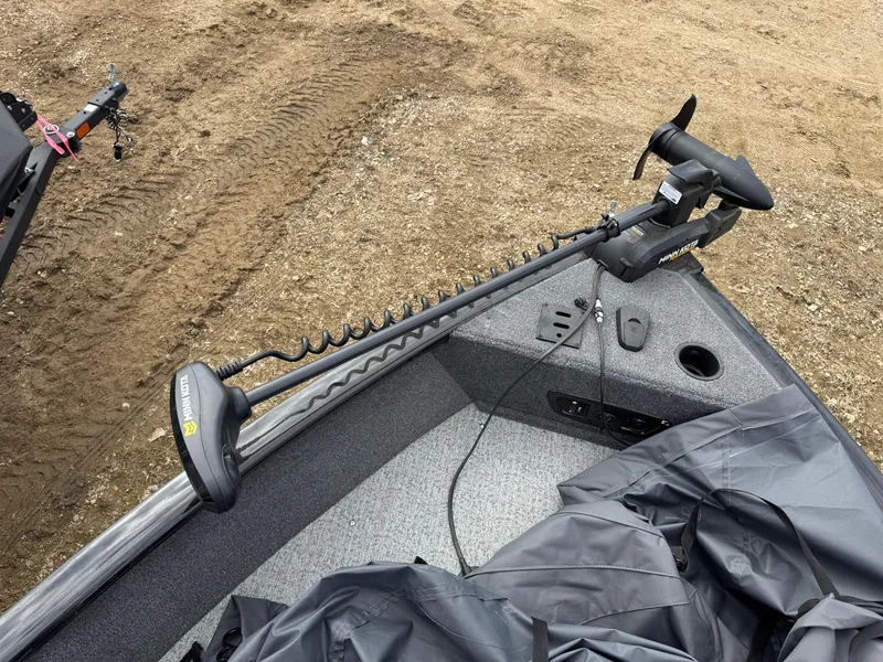 Slide: The Image of 2023 Tracker Pro Guide V-175 WT boat with trolling motor on a sandy shore. - 5