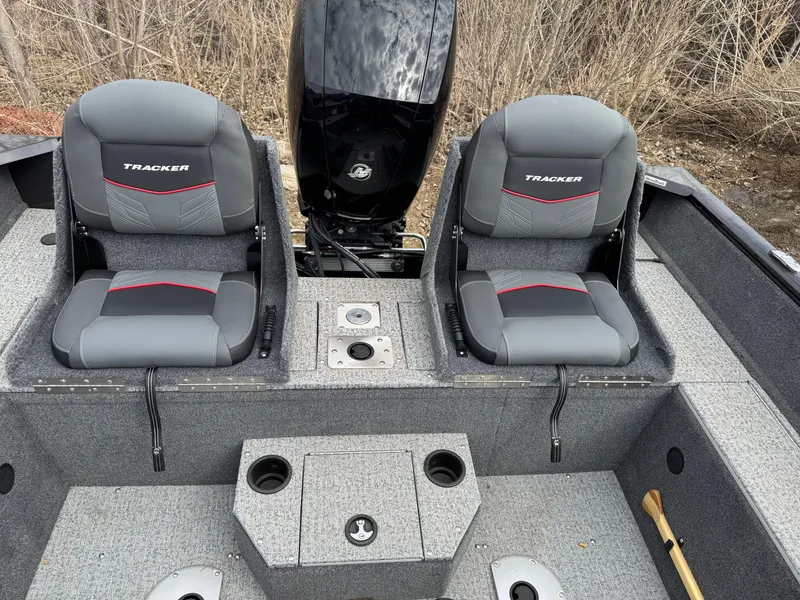 Slide: The Image of 2023 Tracker Pro Guide V-175 WT boat interior with dual seats and motor. - 8