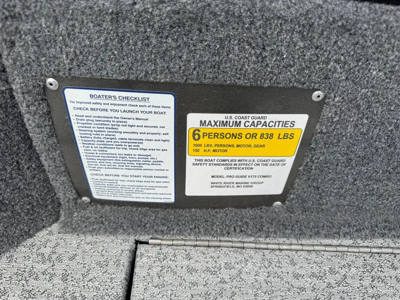 Slide: The Image of 2023 Tracker Pro Guide V-175 WT capacity plate, 6 persons or 838 lbs, safety guidelines. - 9