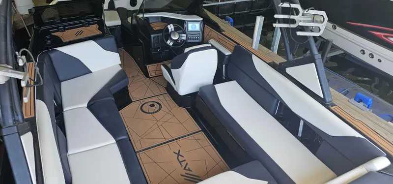 Slide: The Image of 2020 ATX Surf Boats 24 Type-S interior with modern seating and dashboard design. - 12